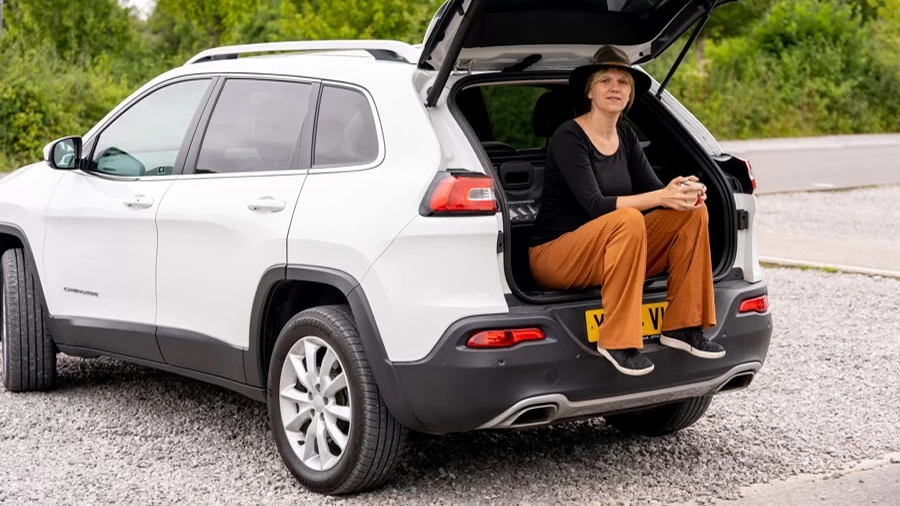 Girl seating on the car Jeep