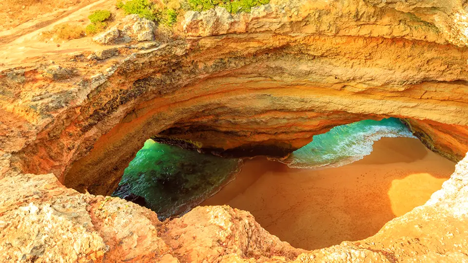 Algarve the famous Algar de Benagil cave on the Algarve coast in Portugal, top view through the opening